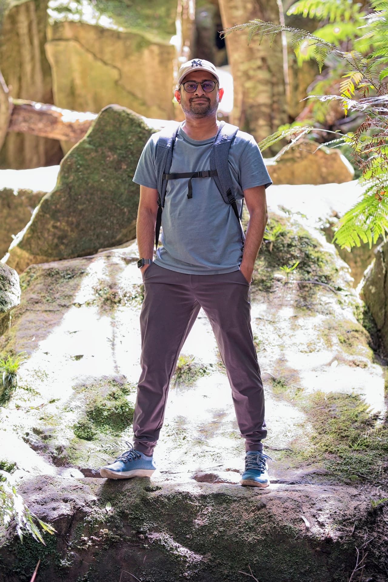 Portrait of Vinay Kulkarni seated outdoors.